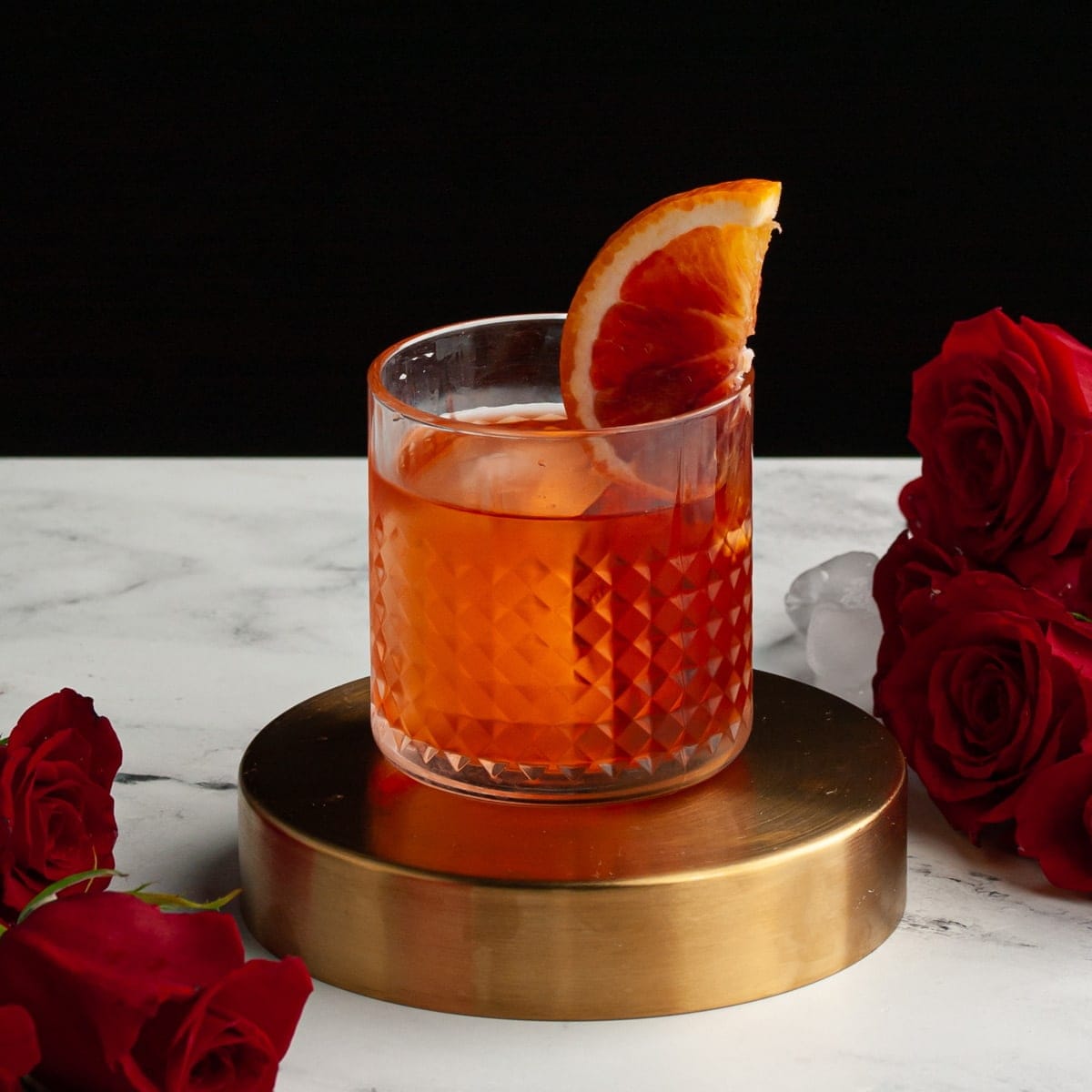 Aperol Negroni in an Old Fashioned glass garnished with blood orange