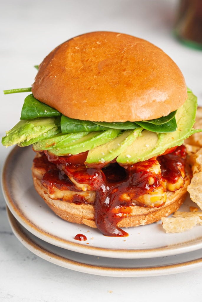 bbq tempeh sandwich with avocado and greens