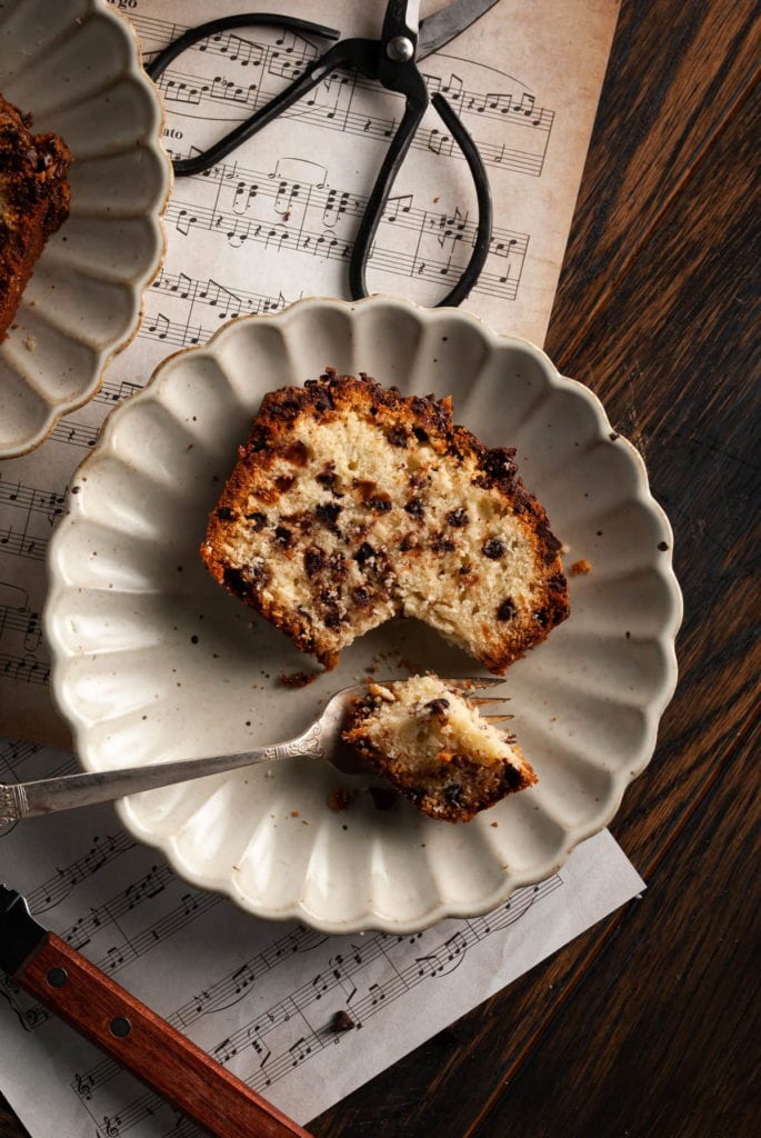 slice of chocolate chip loaf cake with bite on a fork
