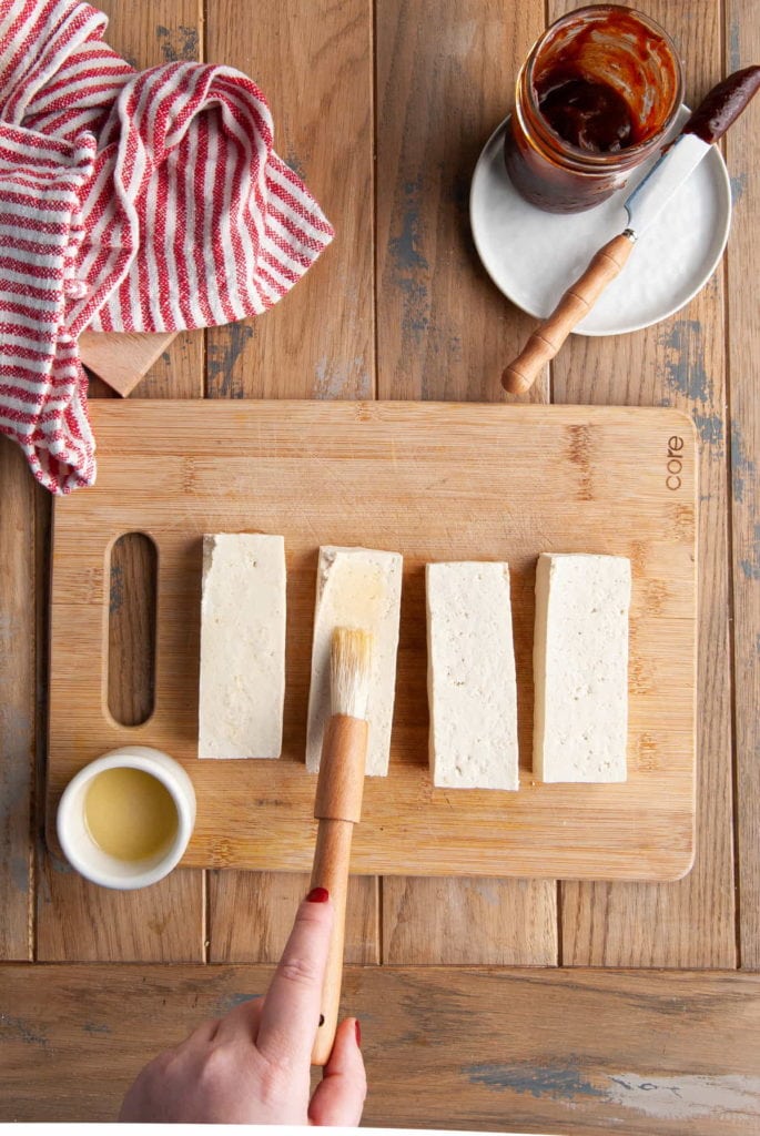 brushing olive oil of tofu