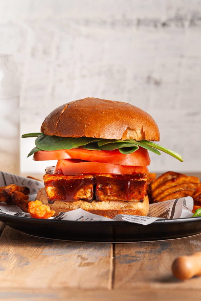 bbq tofu sandwich with tomato and spinach
