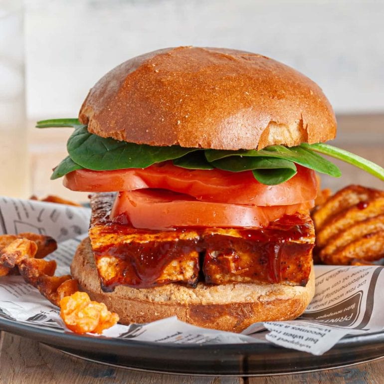 close up of stacked crispy bbq tofu sandwich