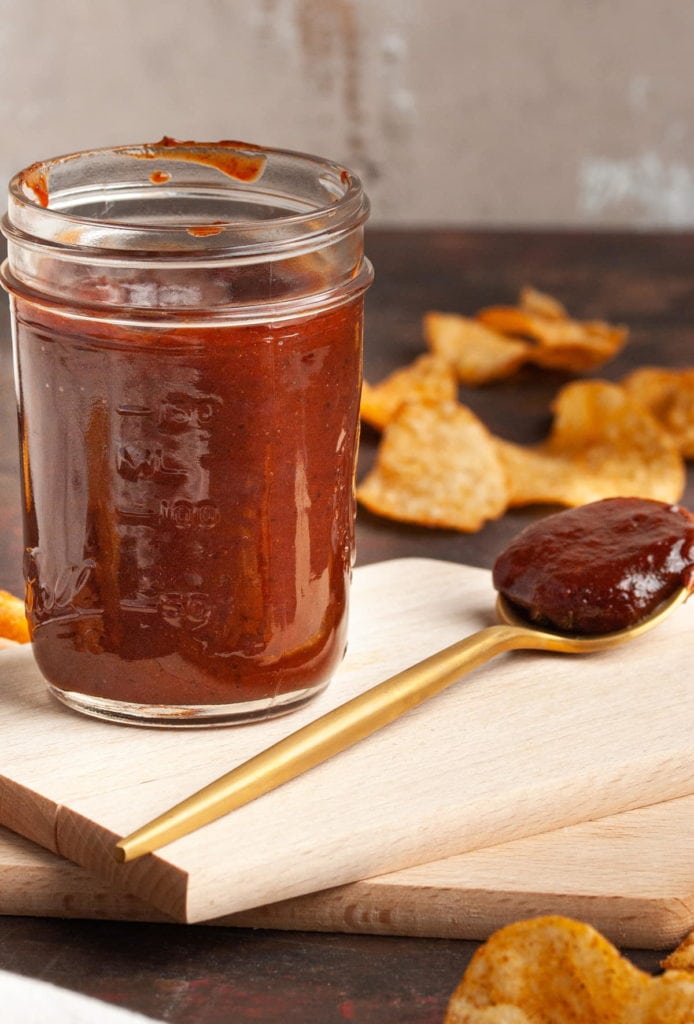 close up of a jar full of easy vegan bbq sauce