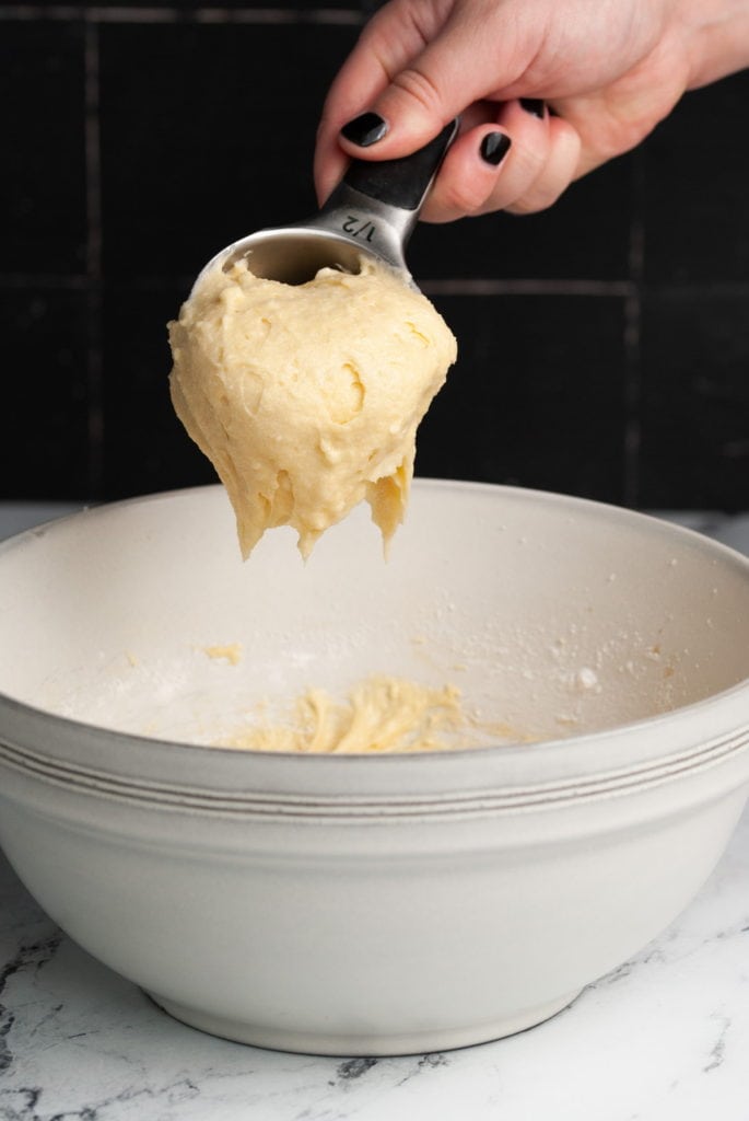 scooping out one half cup of batter to seperate into two