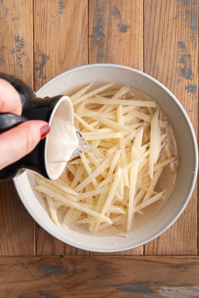 soaking hand cut fries in water