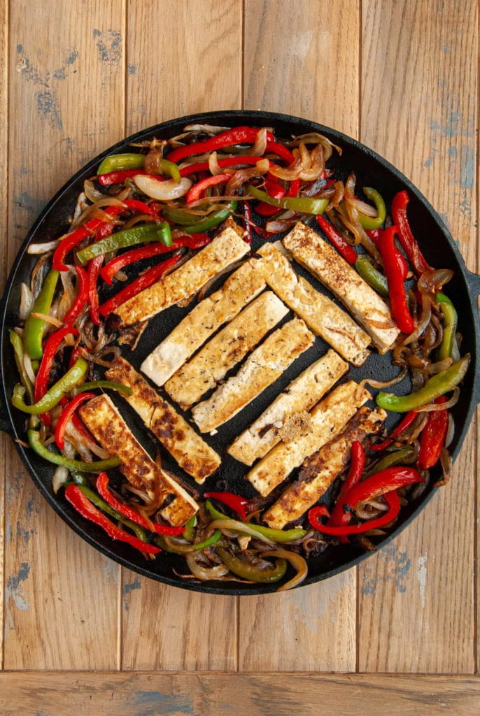 flipping over tofu to make fajitas