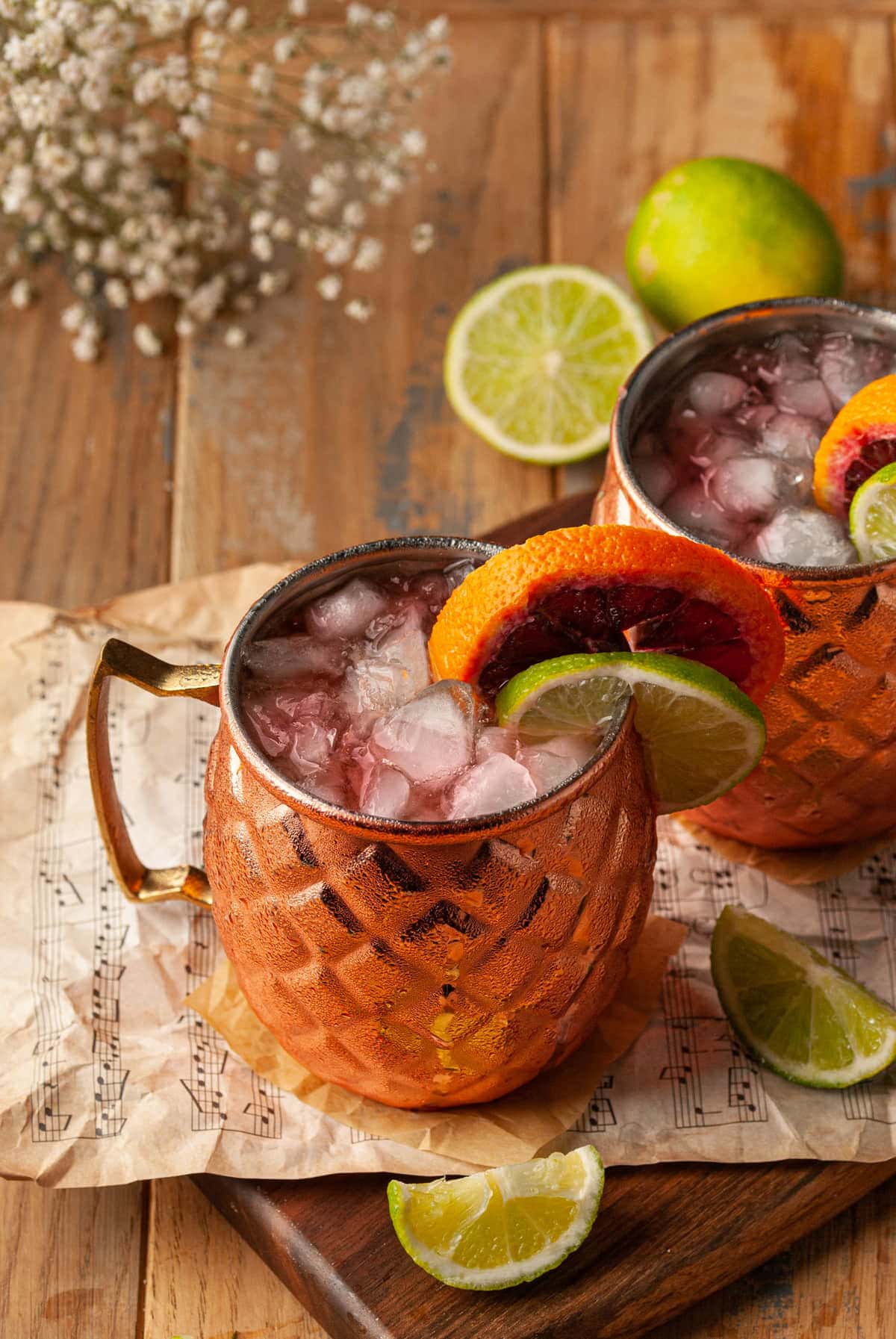 copper mug with red aperol gin and ginger beer cocktail inside