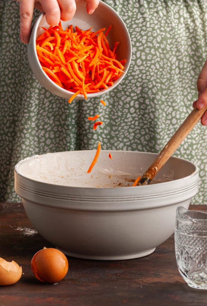 folding carrots into muffin batter