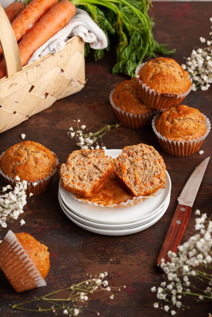 banana carrot muffin split open on stacked plates