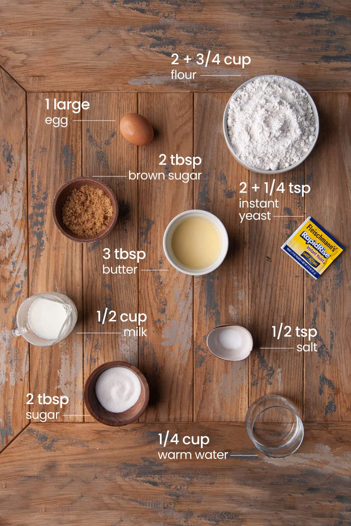 Ingredients for Cinnamon Rolls with Apple Pie Filling - powdered sugar, egg, brown sugar, butter, instant yeast, milk, salt, granulated sugar, and warm water