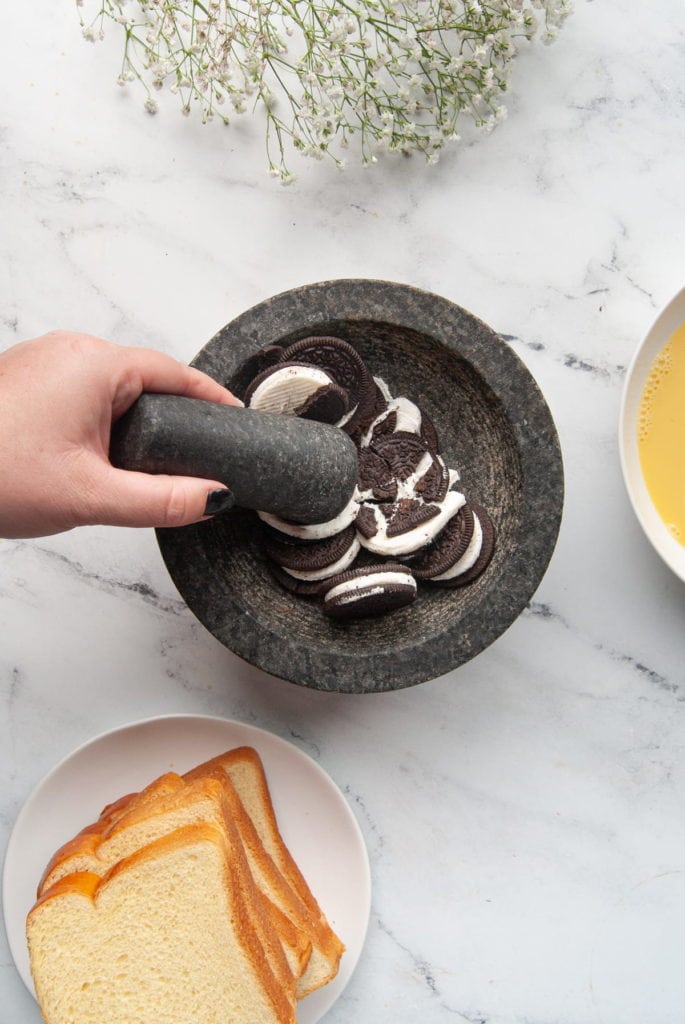 crushing oreos with a mortar and pestle