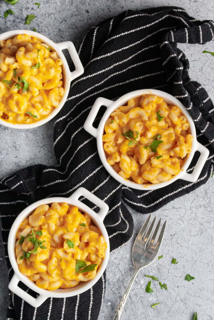 overhead photo of 3 individual servings of vegan truffle mac and cheese