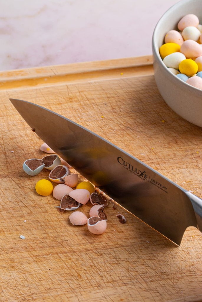 Using a sharp knife to slice into cadbury mini eggs