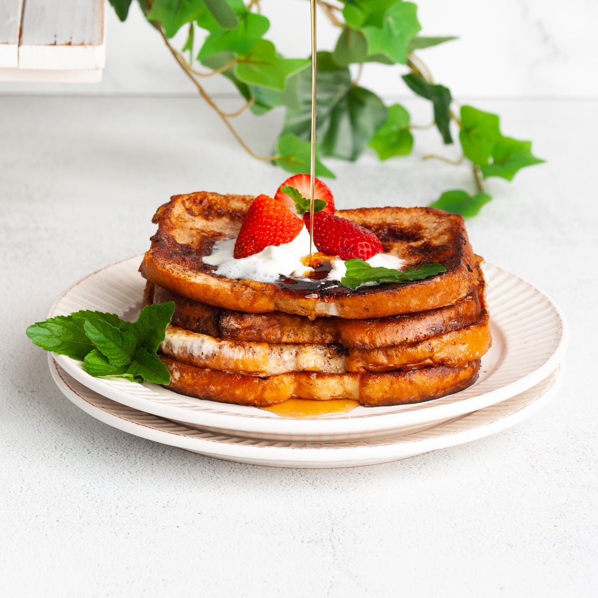 Easy Egg White French Toast Stacked on Two Plates