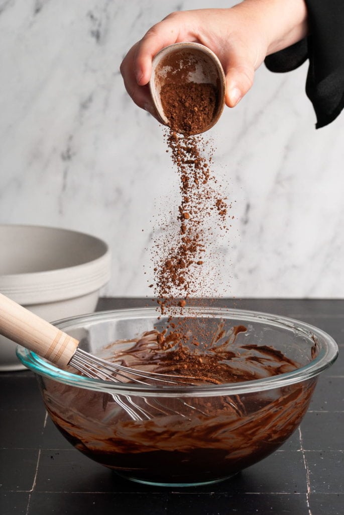adding cocoa powder to chocolate filling for oreo cinnamon rolls