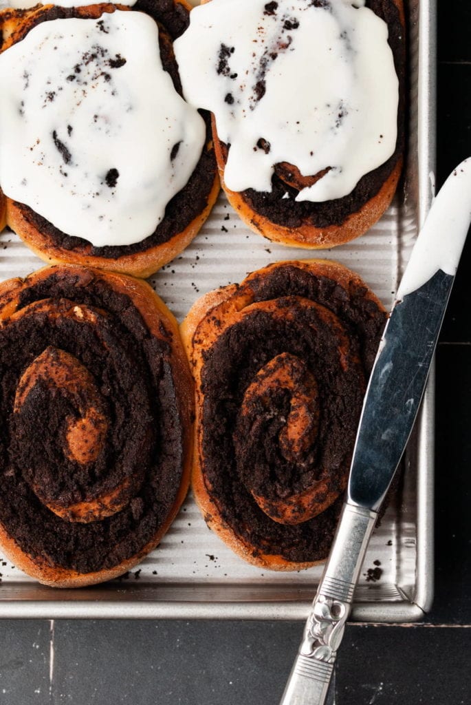 close up overhead shot of oreo cinnamon rolls in a baking pan