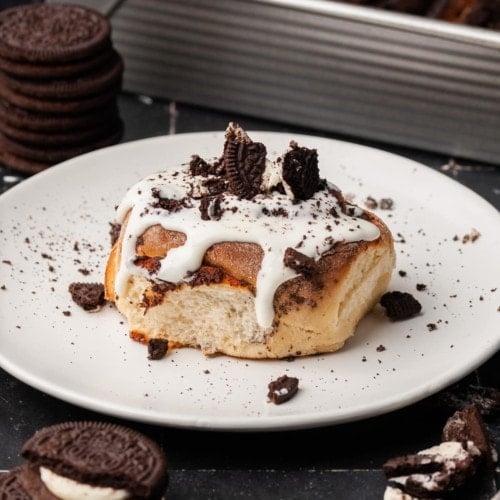 Oreo Cinnamon Roll with Cream Cheese Frosting on a plate