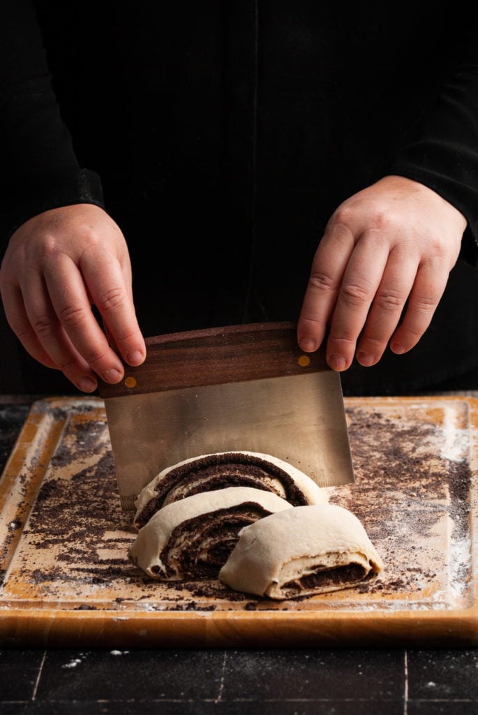 cutting oreo cinnamon rolls into individual rolls