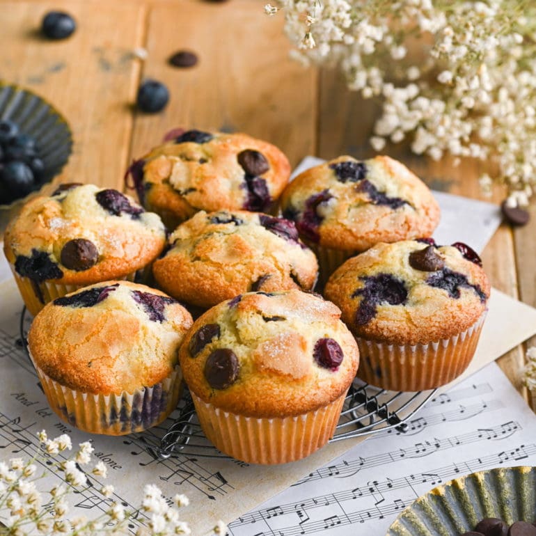 7 Blueberry Chocolate Chip Muffins on a cooling rack