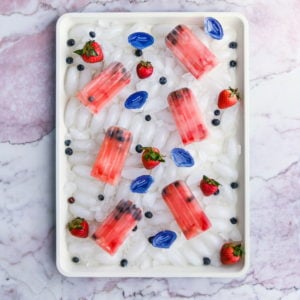 6 antioxidant popsicles with fresh berries surrounded by Blueshift pods