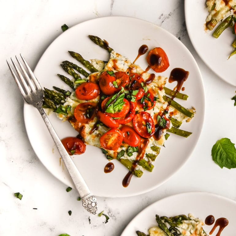 Easy Cheesy Caprese Asparagus close up on a plate