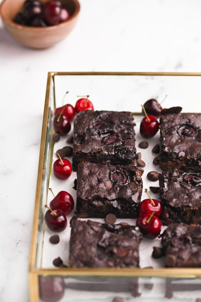 fudgy chocolate cherry brownies in a gold trimmed tray