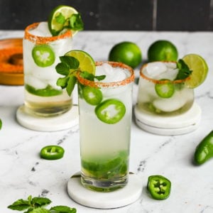 3 spicy mojitos with jalapeno on coasters