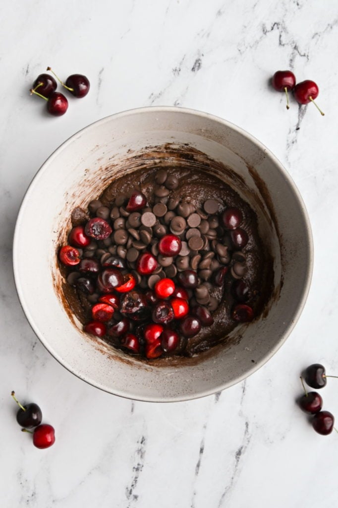 brownies batter with fresh cherries and chocolate chips