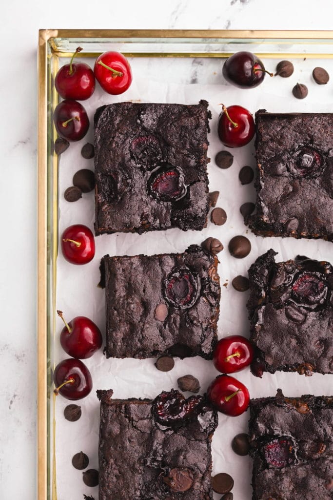 cherry brownies in a gold trimmed tray