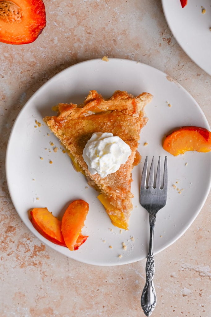 slice of peach mango pie with all-butter blender pie crust