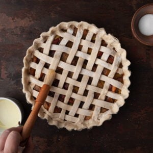 all-butter blender pie crust with lattice being brushed with eggwash