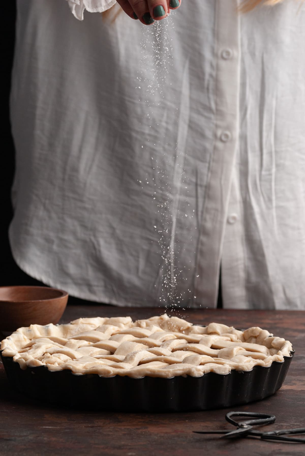 sprinkling sugar on top of lattice pie crust