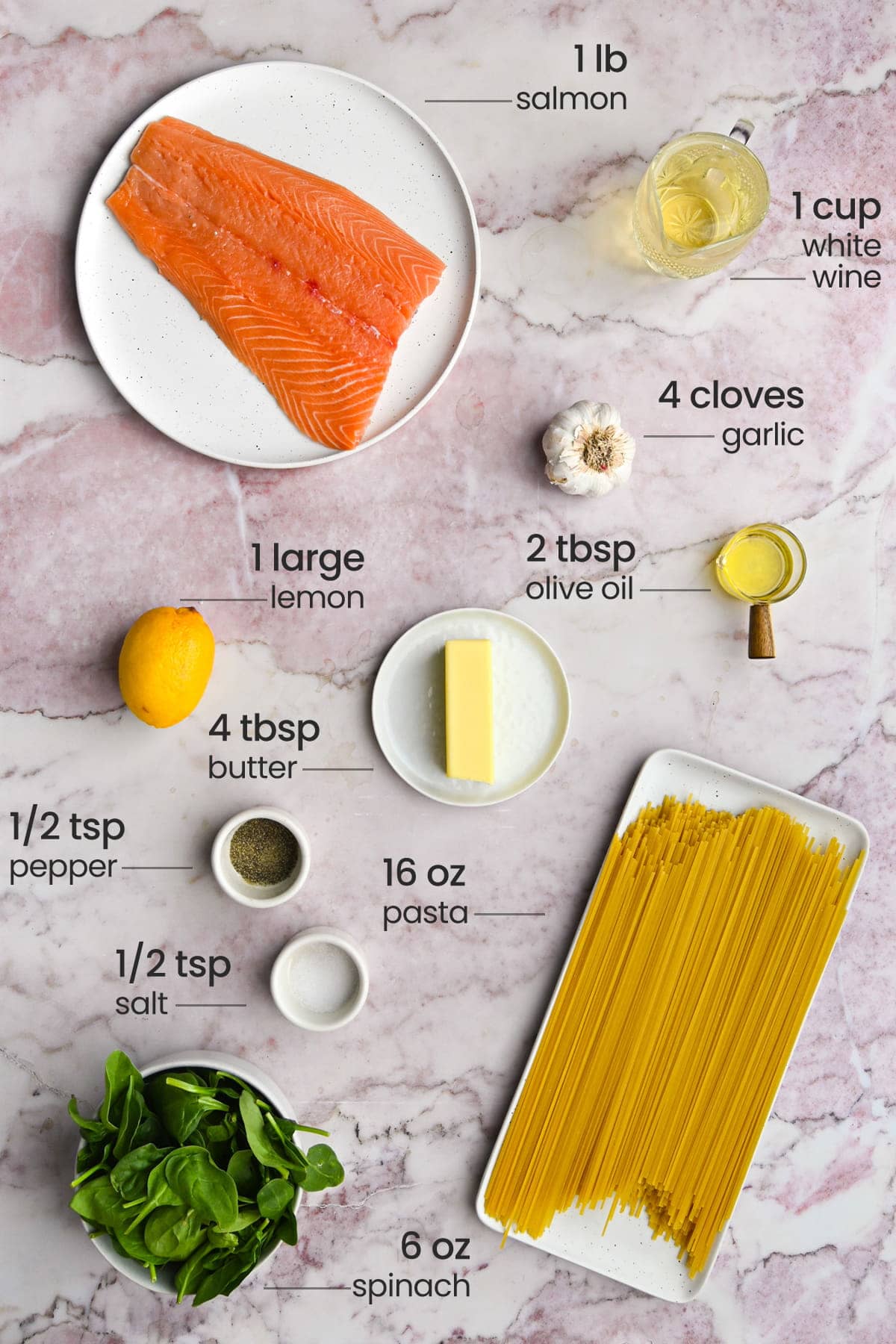 ingredients for salmon spinach pasta - salmon, white wine, garlic, olive oil, lemon, unsalted butter, pepper, salt, linguine, spinach