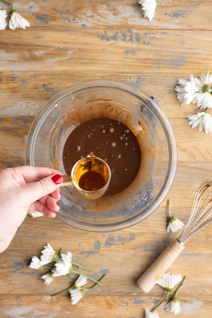 adding bourbon to chocolate and cream