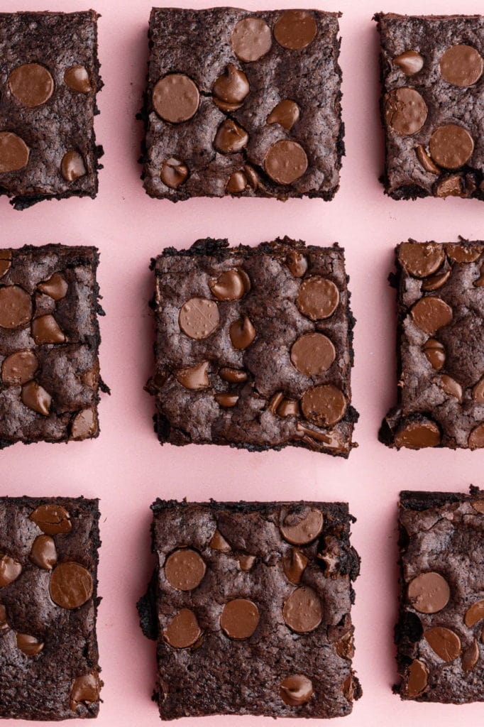 dairy free brownies on a pink backdrop