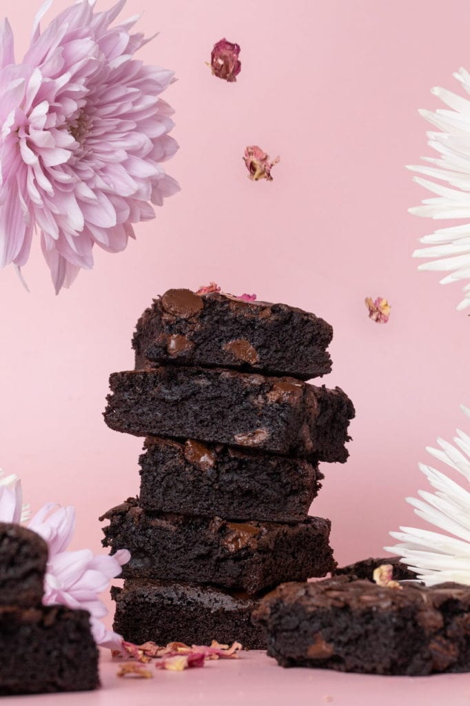 rose petals falling on a stack of dairy free brownies