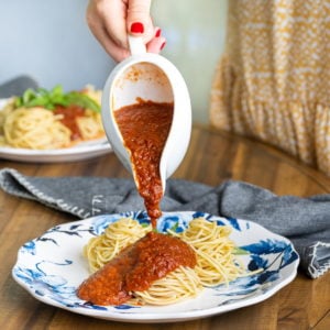 serving meatless spaghetti sauce overtop plain spaghetti