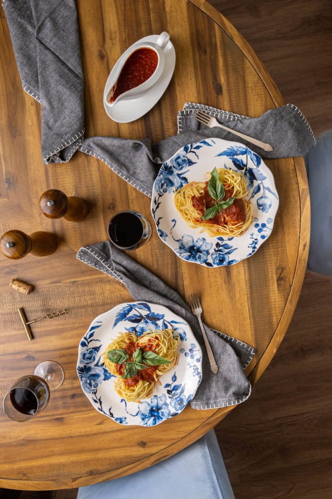 overhead shot of italian tablescape with spaghetti and meatless sauce