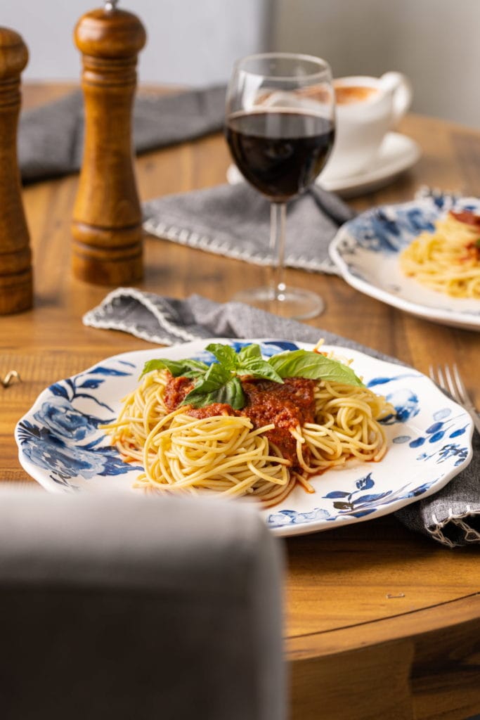 Italian table setting with dining chair out of focus