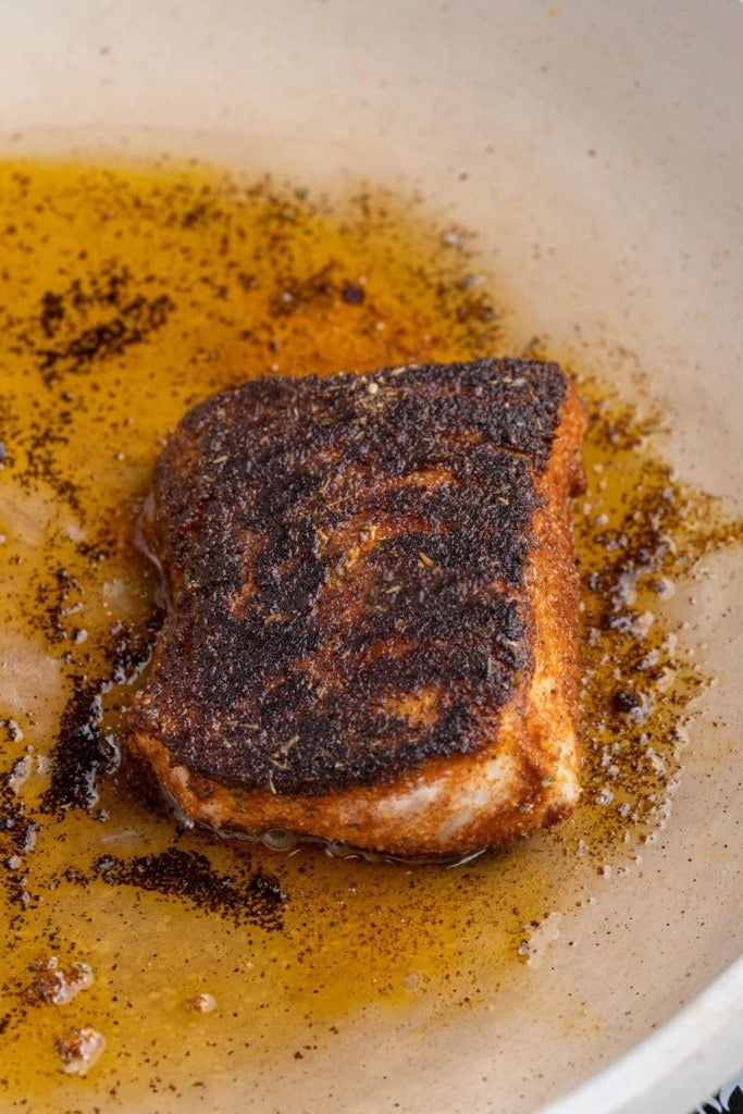 flipping blackened cod in the pan