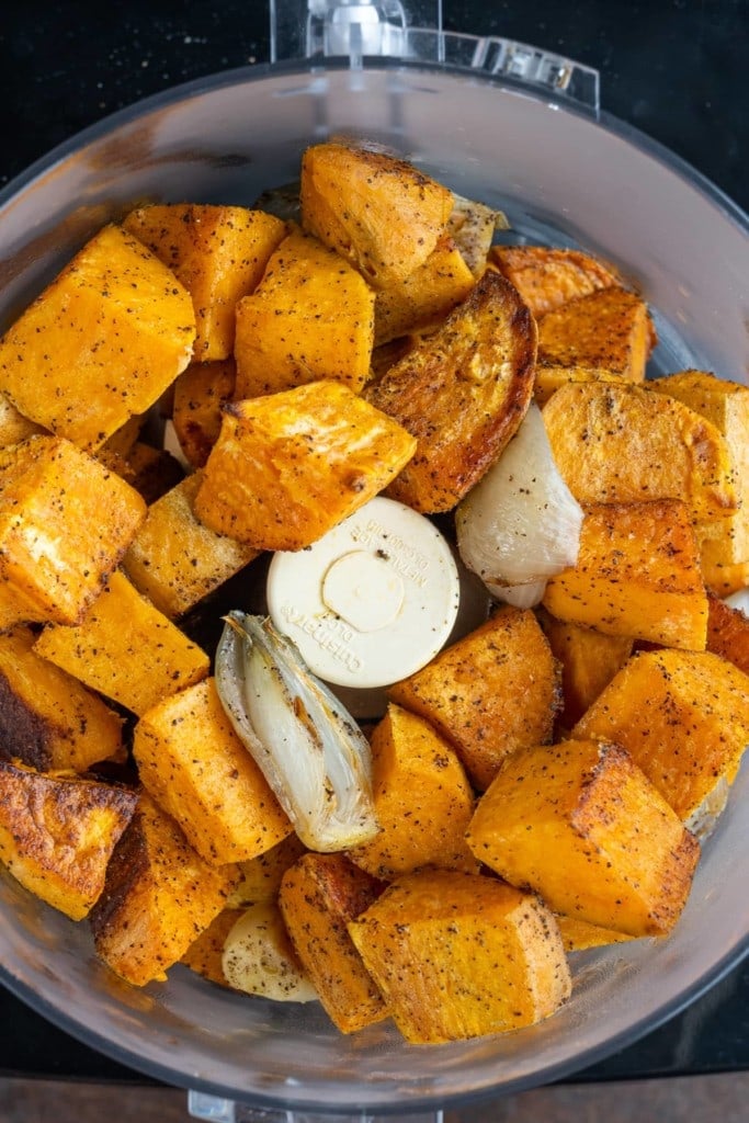 Adding all Sweet Potato Soup ingredients to a food processor.