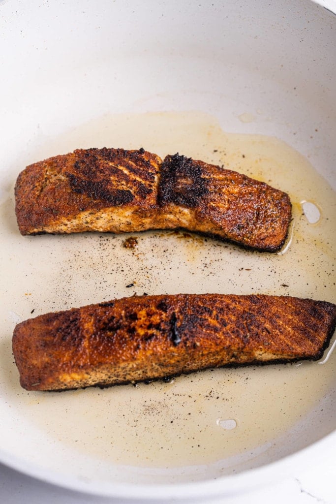 Blackening salmon in a pan