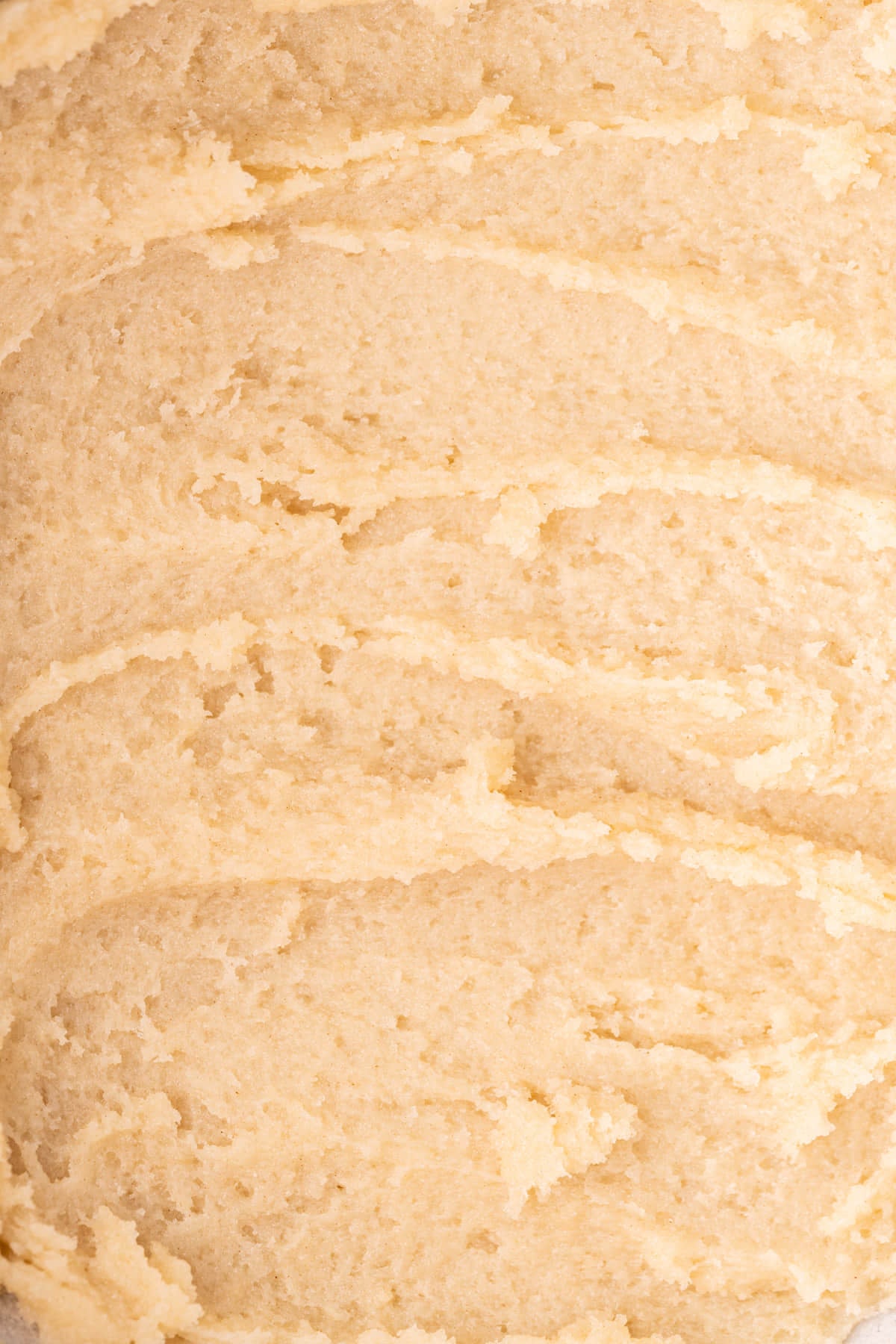 Super zoomed close up of edible sugar cookie dough to show texture. 