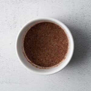 a flax egg in a white ramekin