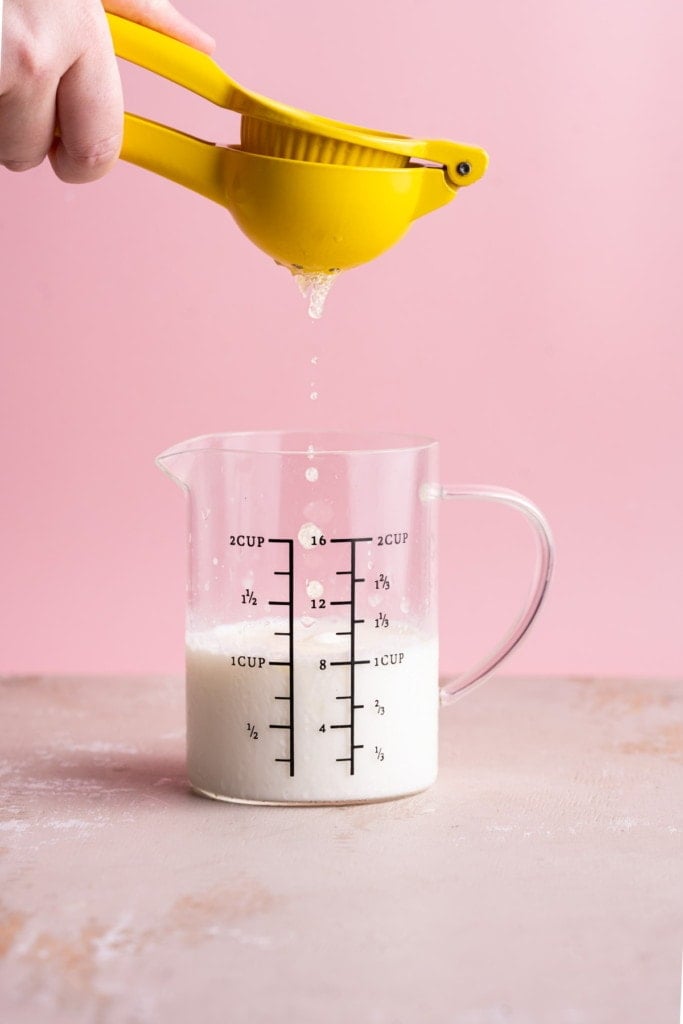 Squeezing lemon juice into milk to make buttermilk