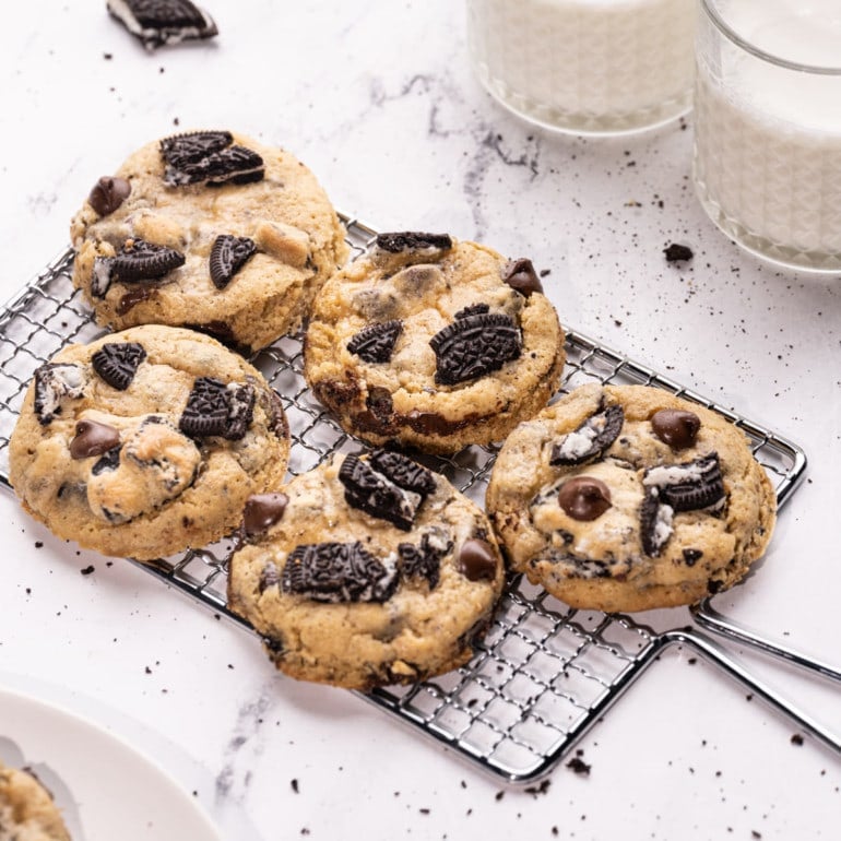 Oreo Chocolate Chip Cookies with two glasses of milk