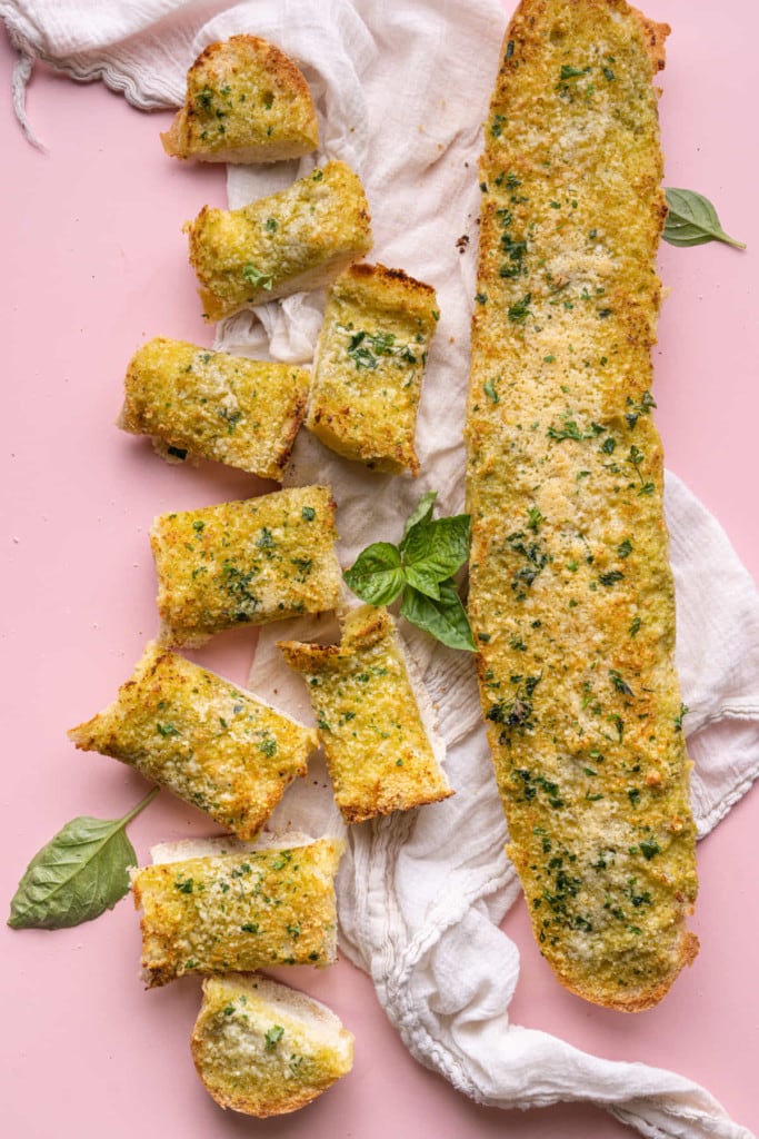 Pesto Butter Garlic Bread with half sliced and half whole