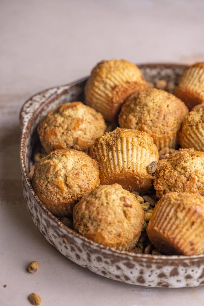 Dish filled with just-baked Pistachio Muffins