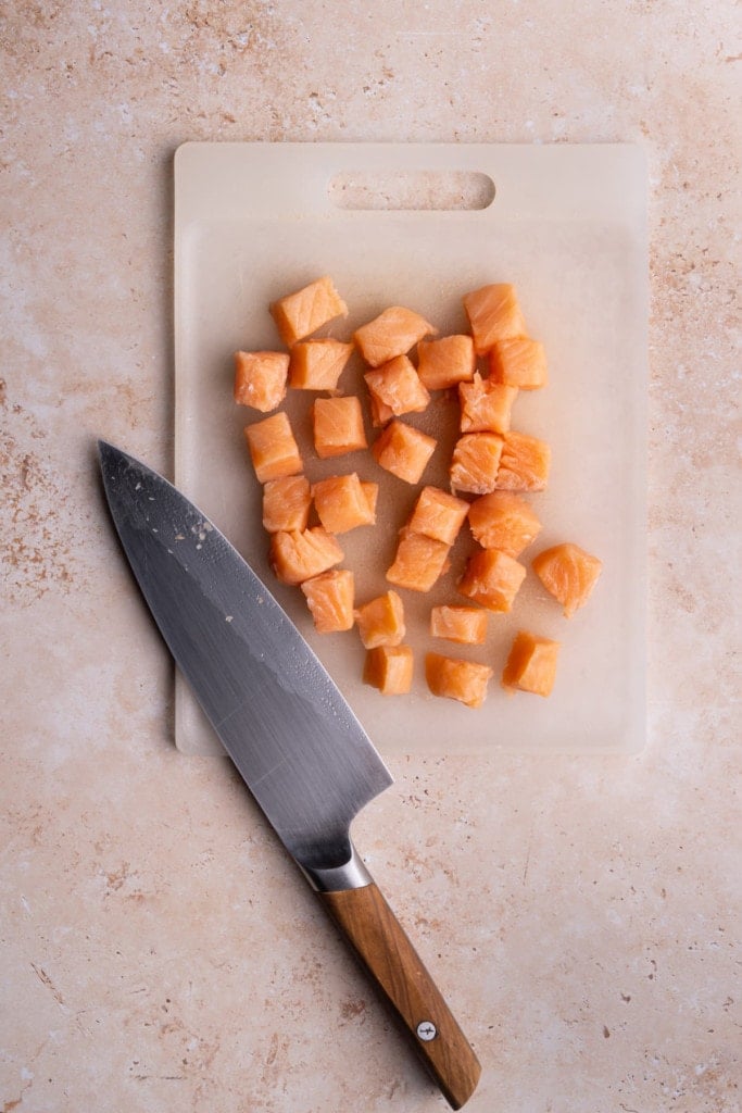 Cutting the salmon into cubes