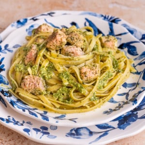 Salmon Pesto Pasta on blue and white plates